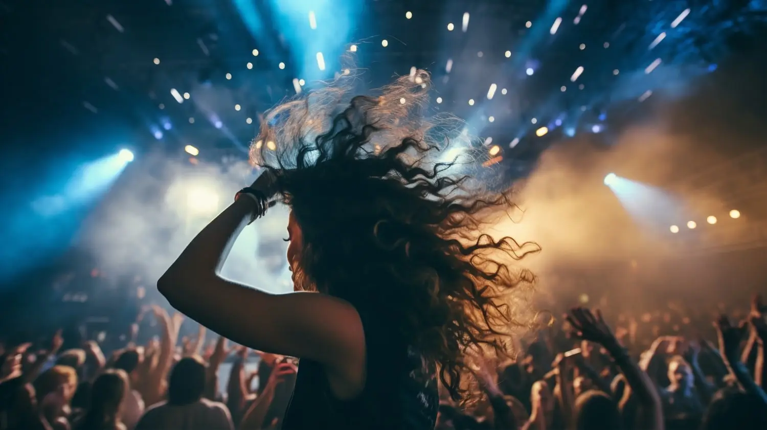 Crowd enjoying a nightlife party with DJ and lights