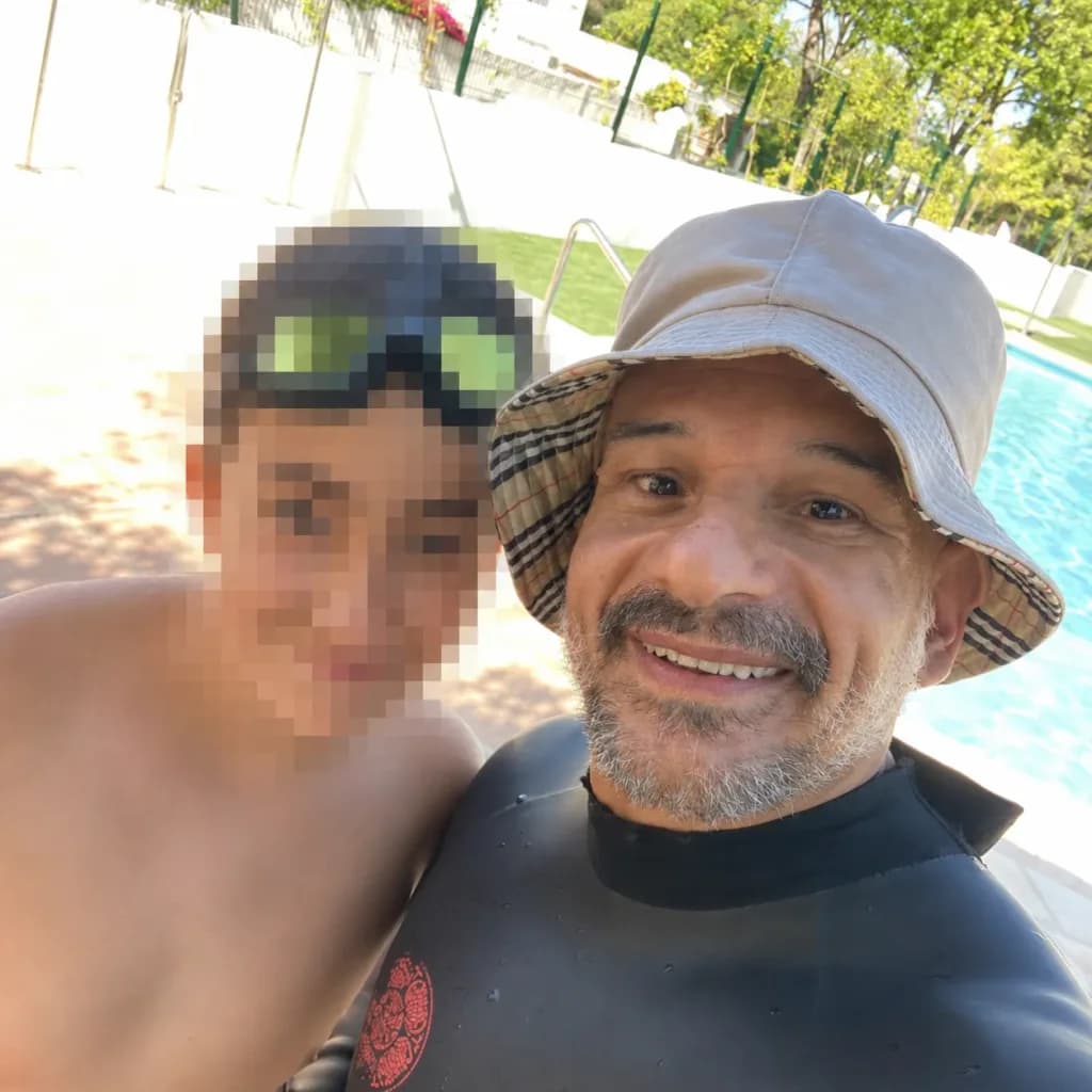 Swimming instructor by a private pool with a pixelated student, a trust-building image for private children’s swimming lessons in Marbella.