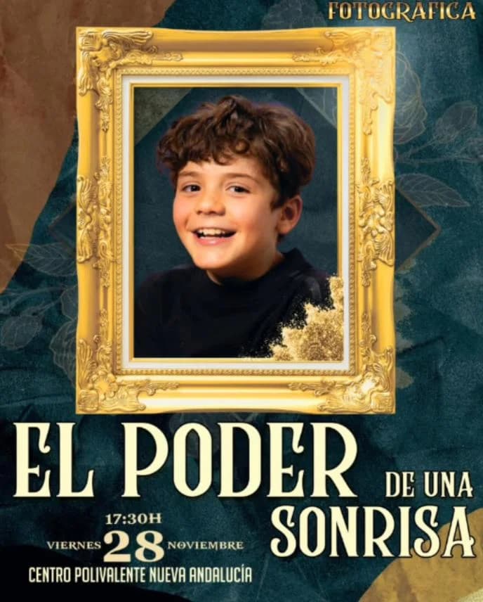 Poster of “El poder de una sonrisa” exhibition with a smiling boy’s portrait inside an ornate gold frame on a dark blue background, with the text Friday 28th November, 5:30 pm, Centro Polivalente Nueva Andalucía.