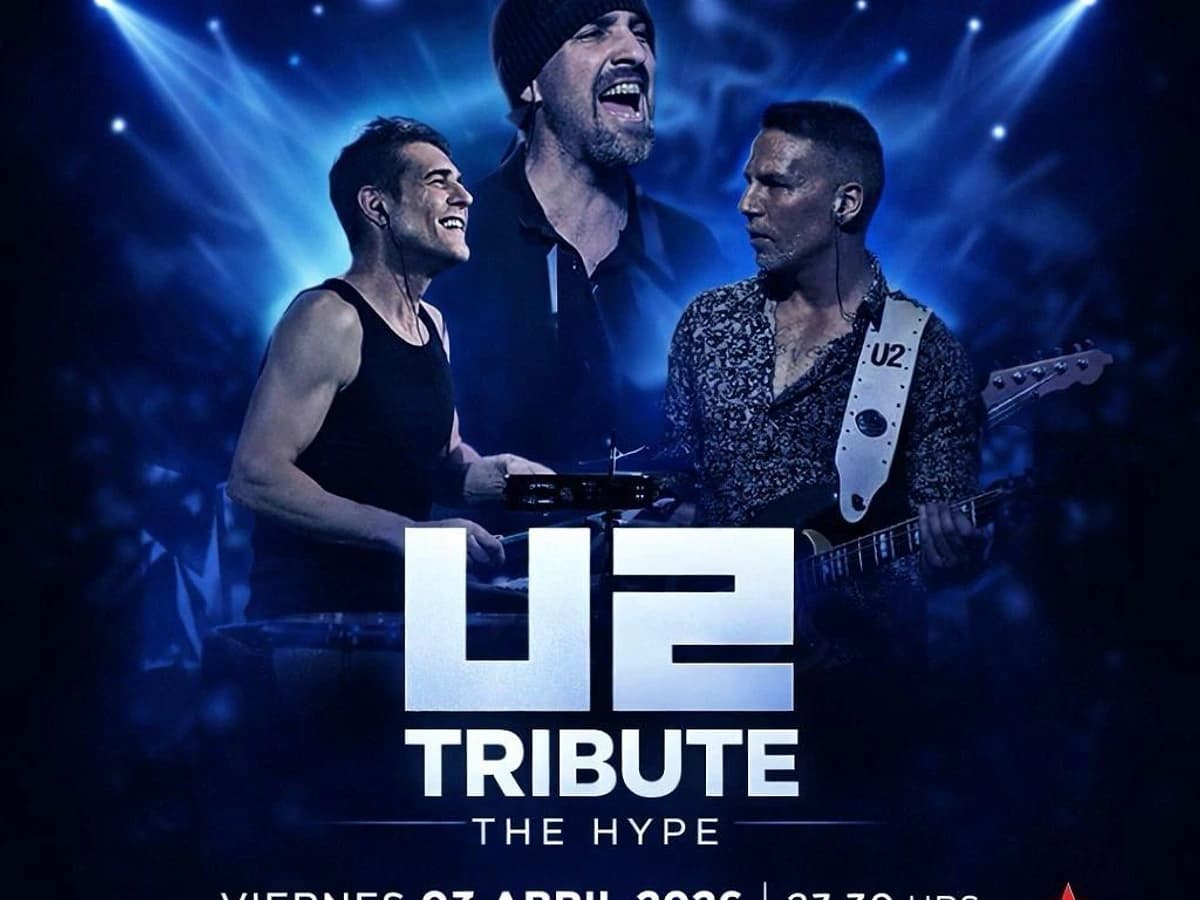 Cartel promocional de The Hype, tributo a U2, en Premiere Club con tres músicos sobre un fondo azul de luces de escenario. El concierto es el viernes 3 de abril de 2026 a las 23:30 h en Marbella.