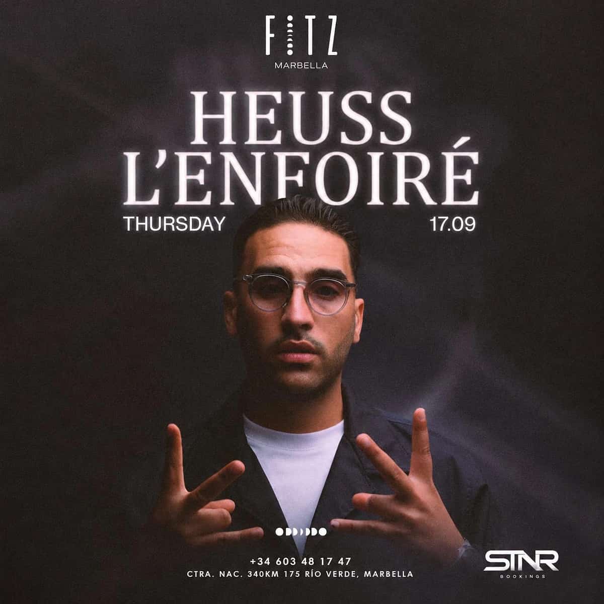 Cartel de Heuss L’Enfoiré en FITZ Marbella para el jueves 17 de septiembre, con fondo oscuro, retrato del artista con gafas, logo de FITZ y tipografía blanca luminosa.