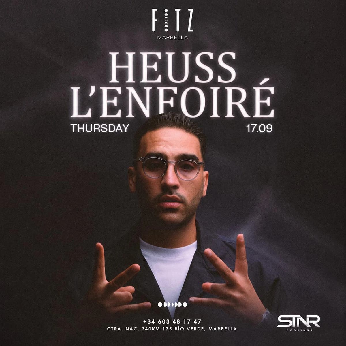 Cartel de Heuss L’Enfoiré en FITZ Marbella para el jueves 17 de septiembre, con fondo oscuro, retrato del artista con gafas, logo de FITZ y tipografía blanca luminosa.