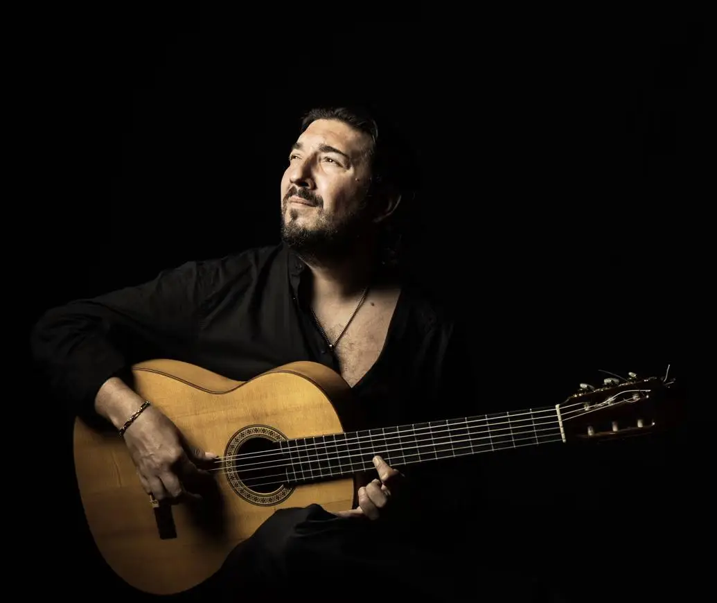 Flamenco guitarist Antonio Rey Navas performing an emotive live concert at Teatro Cervantes, Málaga