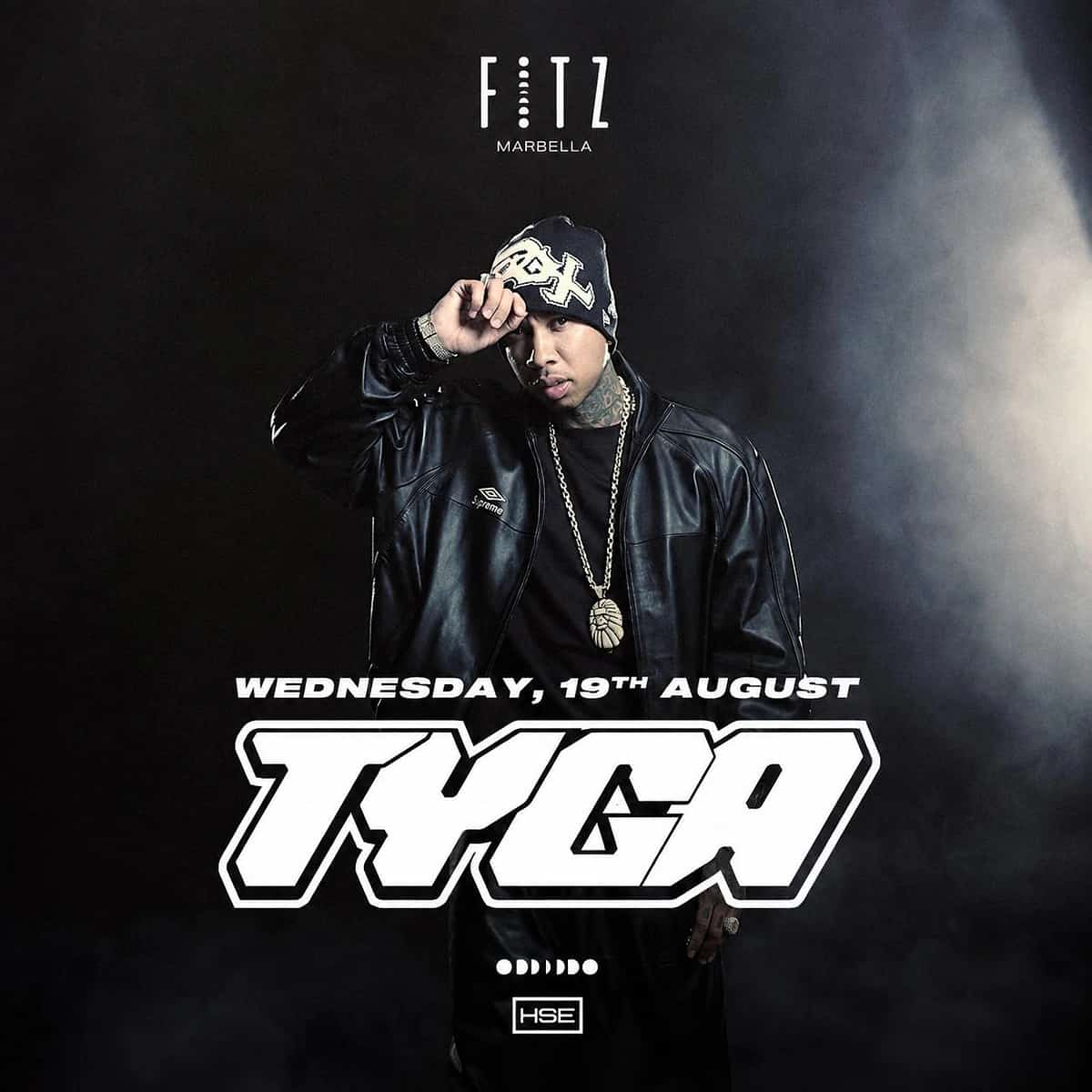 Cartel de Tyga en FITZ Marbella para el miércoles 19 de agosto, con fondo negro, retrato del artista con gorro, chaqueta de cuero y joyas, y gran tipografía blanca.