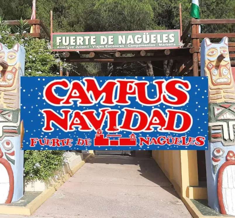 Entrada del Fuerte de Nagüeles con el cartel “Campus de Navidad – Marbella 2025”; campamento infantil (22, 23, 29 y 30 dic), 10:00–16:00, matinal 8:00–10:00, 3–14 años, 125 € con almuerzo.