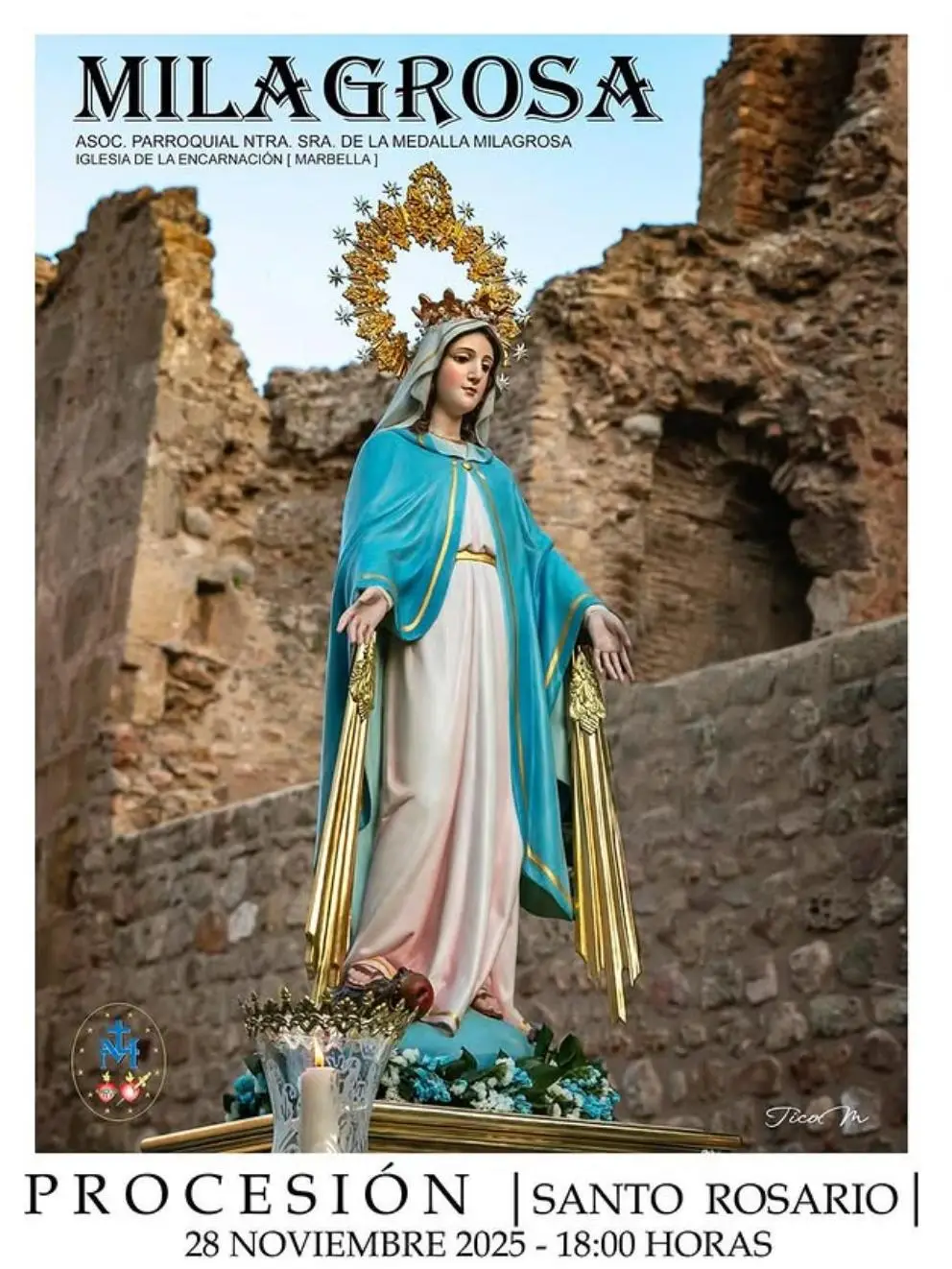 Poster for the procession of Our Lady of the Miraculous Medal in Marbella, showing the statue of the Virgin dressed in white with a blue mantle and golden halo in front of a stone wall, with text announcing “Procession | Holy Rosary | 28 November 2025 – 6:00 p.m.” and the route through the old town streets.