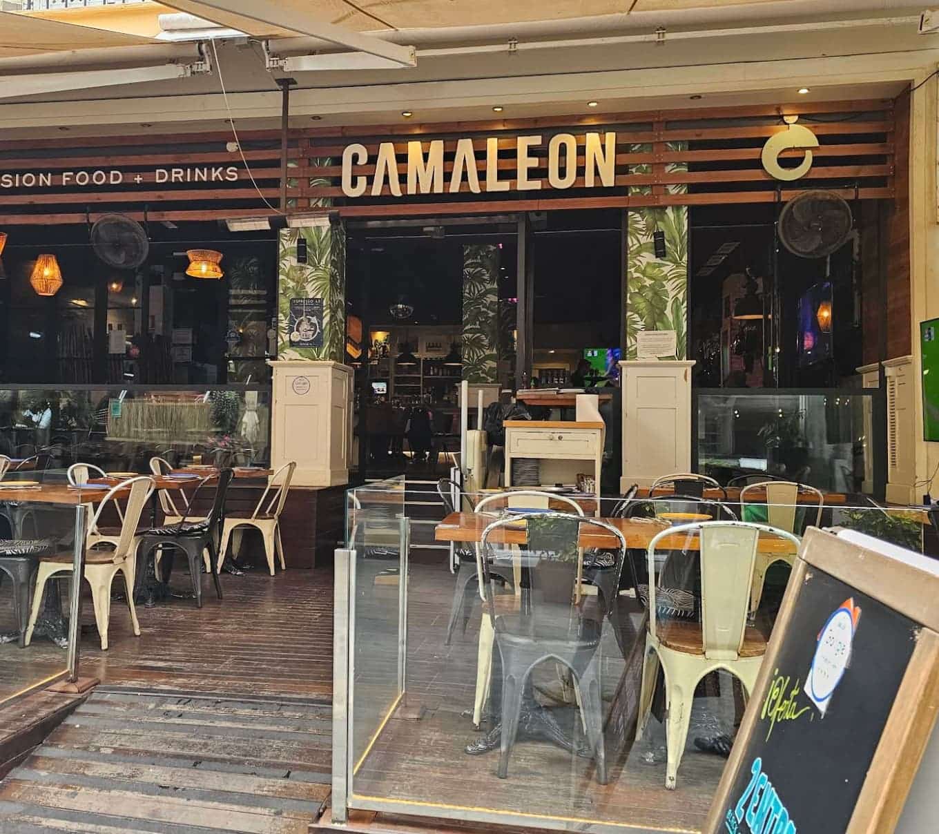 Facade and outdoor terrace of CamaleĂłn Marbella at Av. Miguel Cano 13, central Marbella.