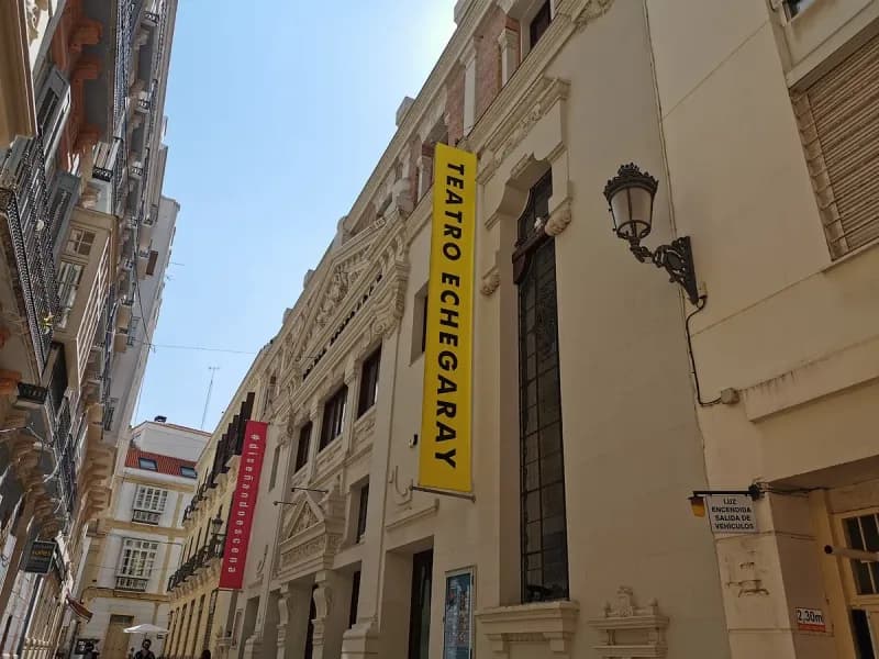 Exterior view of the Teatro Echegaray in Málaga, showcasing its admired 1932 historicist façade and main entrance.
